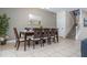 Elegant dining room featuring a wooden table with seating for six and a large mirror at 1439 Moon Valley Dr, Davenport, FL 33896