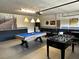 Fun game room with a pool table and foosball, perfect for entertainment at 1439 Moon Valley Dr, Davenport, FL 33896