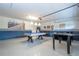 Spacious game room with pool table, foosball table, bright lighting, and neutral flooring at 1439 Moon Valley Dr, Davenport, FL 33896