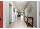 Inviting hallway with tiled flooring and stylish decor leading to the home's interior spaces at 1439 Moon Valley Dr, Davenport, FL 33896