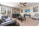 Comfortable living room with two sofas, movie posters, and a wall-mounted TV at 1439 Moon Valley Dr, Davenport, FL 33896