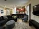 Open living space featuring a modern kitchen and inviting seating area for relaxation at 1439 Moon Valley Dr, Davenport, FL 33896