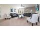 Spacious living room with comfortable seating, movie posters, and a ceiling fan at 1439 Moon Valley Dr, Davenport, FL 33896