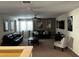 Cozy living room with plush seating, movie themed posters, and a ceiling fan at 1439 Moon Valley Dr, Davenport, FL 33896