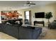 Spacious open living area with modern furnishings, an inviting sofa, and a mounted television at 1439 Moon Valley Dr, Davenport, FL 33896