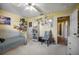 Spacious bedroom with painted walls, book shelves, and a large bed and view into the hallway at 149 Spanish Bay Dr, Sanford, FL 32771