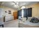 Cozy bedroom with vaulted ceiling, light walls, and a plush bed and coordinating furnishings at 149 Spanish Bay Dr, Sanford, FL 32771