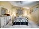 Relaxing bedroom with neutral color palette, plush carpeting, and a metal-framed bed, complemented by decorative accents at 149 Spanish Bay Dr, Sanford, FL 32771