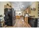 Kitchen featuring stainless steel refrigerator, wooden cabinets, and eat-in breakfast area at 149 Spanish Bay Dr, Sanford, FL 32771