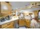 A bright kitchen features wood cabinets, laminate countertops, and stainless steel appliances, with an open layout to the dining area at 149 Spanish Bay Dr, Sanford, FL 32771