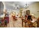 Spacious living room featuring wood floors, decorative furniture, and an ornate chandelier at 149 Spanish Bay Dr, Sanford, FL 32771