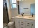 Bathroom featuring a double vanity, and glass-enclosed shower at 15095 Grove Lake Dr, Winter Garden, FL 34787