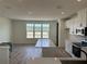 Bright kitchen featuring an island and modern appliances at 15095 Grove Lake Dr, Winter Garden, FL 34787