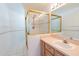 Bathroom featuring a glass-enclosed shower, vanity with sink and neutral ceramic tile flooring at 1586 Antoinette Ct, Oviedo, FL 32765