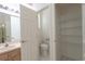 Bathroom with a sink, toilet, wire shelves, and doorway visible in the background at 1586 Antoinette Ct, Oviedo, FL 32765