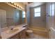 A clean bathroom with a bathtub, vanity, and tiled walls at 1586 Antoinette Ct, Oviedo, FL 32765