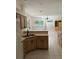 Open kitchen with breakfast bar area and view to the pool at 1586 Antoinette Ct, Oviedo, FL 32765