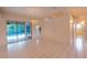 Spacious living room with tiled floor, sliding glass doors to pool area and natural light at 1586 Antoinette Ct, Oviedo, FL 32765