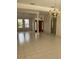 Bright, open living area with tile flooring and a view of the front door at 1586 Antoinette Ct, Oviedo, FL 32765