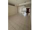 Open-concept living room featuring tile floors and decorative lighting fixtures at 1586 Antoinette Ct, Oviedo, FL 32765