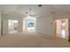 Large main bedroom with carpeted floors, pool access, and access to en-suite bathroom and walk-in closet at 1586 Antoinette Ct, Oviedo, FL 32765