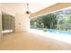 Covered patio leads to pool and screened enclosure at 1586 Antoinette Ct, Oviedo, FL 32765