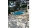 Inviting screened-in pool with surrounding patio, ideal for enjoying sunny days and warm evenings at 1586 Antoinette Ct, Oviedo, FL 32765
