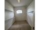 Walk-in closet with custom shelving at 1586 Antoinette Ct, Oviedo, FL 32765