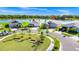 Well-manicured lawns and mature trees surround this house creating a park-like setting at 1596 Contentment Loop, Kissimmee, FL 34744