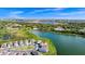Beautiful aerial view of a lakeside community with lush landscaping and stunning water views at 1596 Contentment Loop, Kissimmee, FL 34744