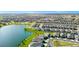 Stunning aerial view of a lakeside neighborhood with well-manicured lawns and beautiful homes at 1596 Contentment Loop, Kissimmee, FL 34744