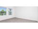 Bedroom with tiled floors and large windows with neighborhood views at 1596 Contentment Loop, Kissimmee, FL 34744