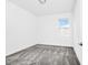Cozy bedroom featuring plush gray carpeting and a window with blinds at 1596 Contentment Loop, Kissimmee, FL 34744