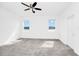 Spacious bedroom with plush carpeting, two windows overlooking the pond, and a closet at 1596 Contentment Loop, Kissimmee, FL 34744