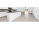 Open-concept kitchen and dining area with modern finishes, stainless steel appliances, and ample space at 1596 Contentment Loop, Kissimmee, FL 34744