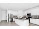 Bright kitchen featuring a spacious island, stainless steel appliances and modern finishes at 1596 Contentment Loop, Kissimmee, FL 34744