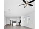 Open-concept living area with lots of natural light, neutral paint colors, and a ceiling fan at 1596 Contentment Loop, Kissimmee, FL 34744