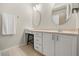 Bathroom featuring vanity with round mirrors, a make up table, and a towel rack at 1705 Saint Tropez Ct, Kissimmee, FL 34744