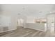 Bright living area featuring wood floors, mirrored closet doors, and an open layout perfect for modern living at 1705 Saint Tropez Ct, Kissimmee, FL 34744
