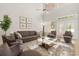 Airy living room with vaulted ceiling, plush rug, and comfortable seating arrangement at 1705 Saint Tropez Ct, Kissimmee, FL 34744