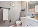 Well lit bathroom with updated vanity, dark hardware, and modern decor at 17516 Blessing Dr, Clermont, FL 34714