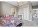 Spacious bedroom featuring neutral tones, carpet flooring, and ensuite bathroom at 17516 Blessing Dr, Clermont, FL 34714