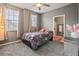 Cozy bedroom featuring neutral tones, carpet flooring, and a ceiling fan at 17516 Blessing Dr, Clermont, FL 34714