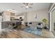 Open living and dining area with stainless steel appliances and a sliding door to the pool at 17516 Blessing Dr, Clermont, FL 34714