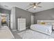 Spacious main bedroom with carpet, a ceiling fan, and ample closet space, designed for comfortable living at 17516 Blessing Dr, Clermont, FL 34714