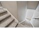 Close-up of carpeted stairs with white trim and neutral walls showcasing the home's well-maintained interior details at 17516 Blessing Dr, Clermont, FL 34714