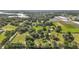Aerial view of estate property with lush greenery and multiple buildings at 17952 Lookout Hill Rd, Winter Garden, FL 34787