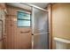 Bathroom shower with tile surround and glass door at 17952 Lookout Hill Rd, Winter Garden, FL 34787