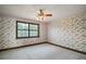 Bedroom with floral wallpaper, carpet flooring, and a window at 17952 Lookout Hill Rd, Winter Garden, FL 34787