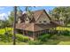 Charming two-story home with a screened-in porch and meticulously landscaped front yard, perfect for relaxation at 17952 Lookout Hill Rd, Winter Garden, FL 34787